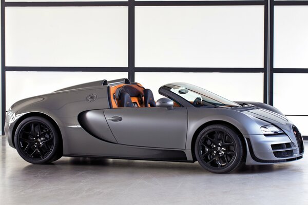 Grey Bugatti veyron car with orange interior