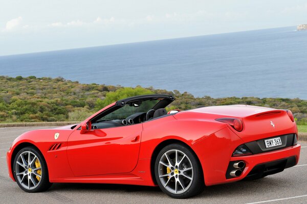 Red ferrari california on the coast