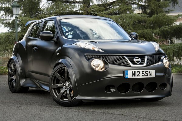 A black Nissan Beetle car