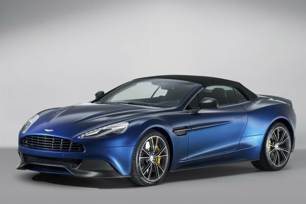 Blue aston martin, vanquish supercar in side view