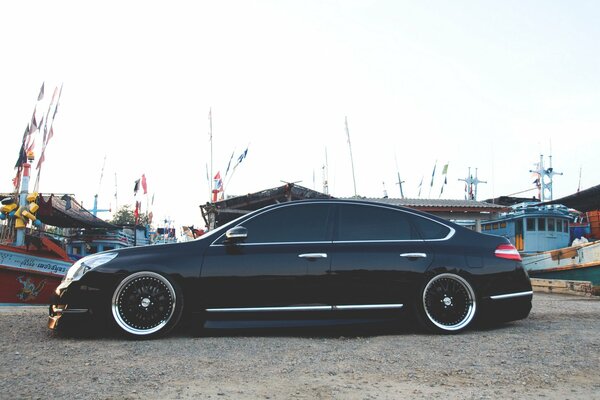 A tinted foreign car on the pier