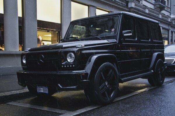 Black gelentvagen in a body kit in the parking lot