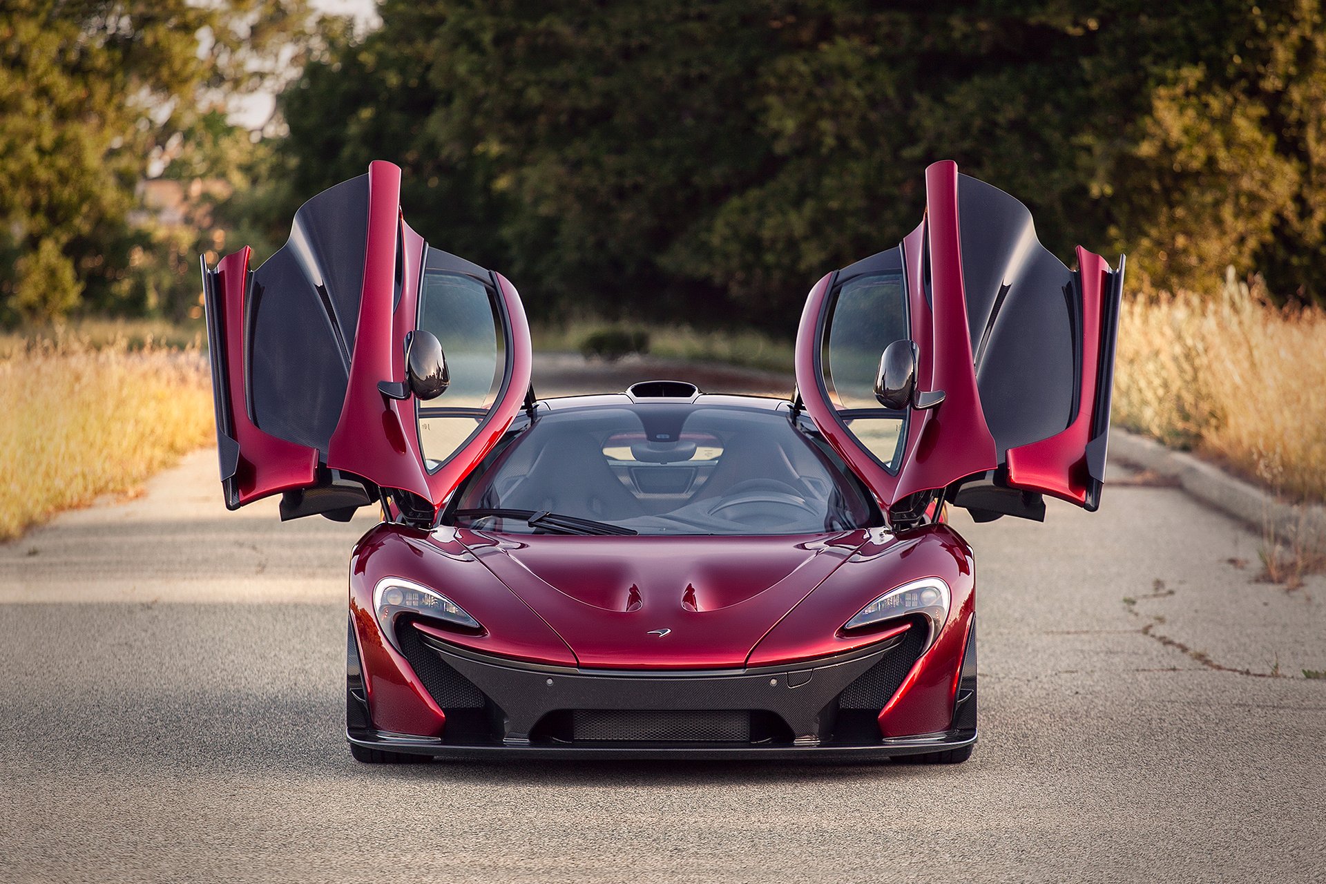 mclaren p1 doors up road