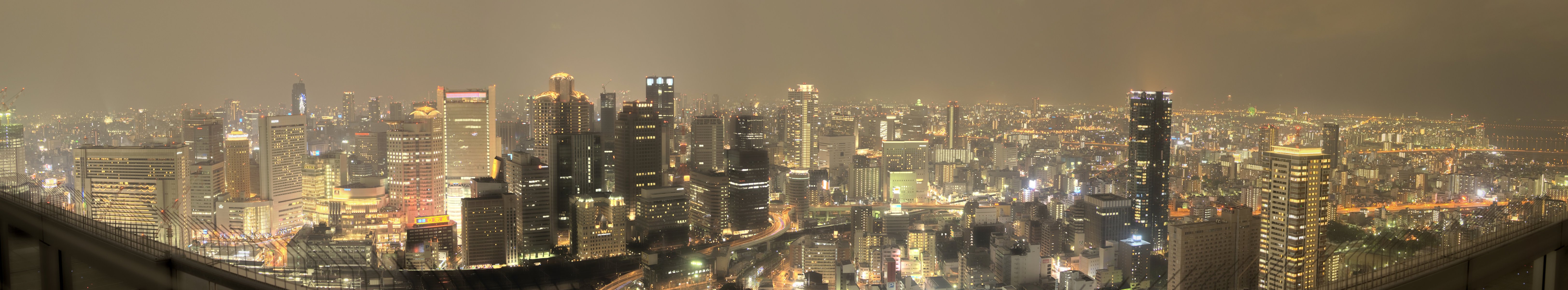 osaka giappone giappone panorama città osaka strada notte luci metropoli grattacieli cielo grigio edifici vista luce nelle finestre architettura