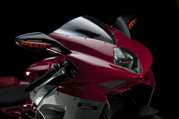 Red motorcycle on a black background