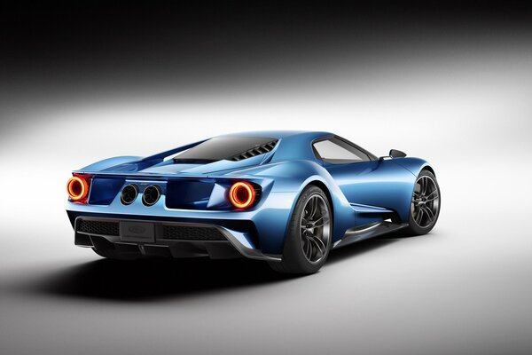 Concepto de coche deportivo azul por detrás