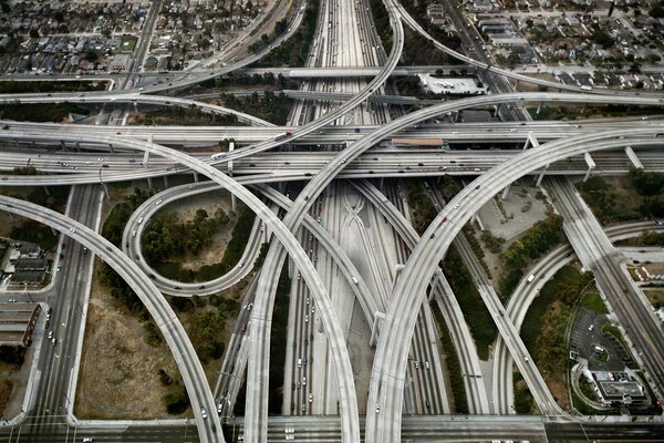 A tangled highway in a gray city