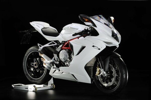 Photo of a white motorcycle on a black background