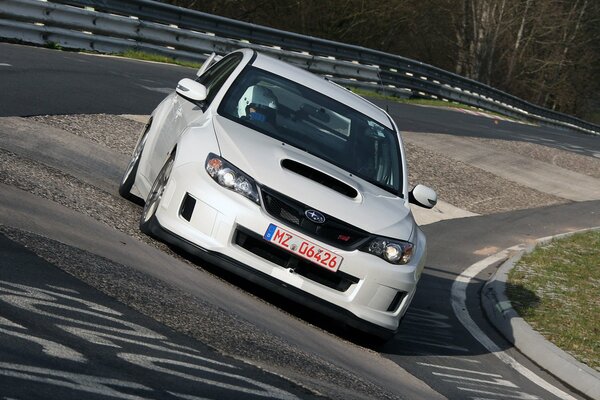 White Subaru on the race track