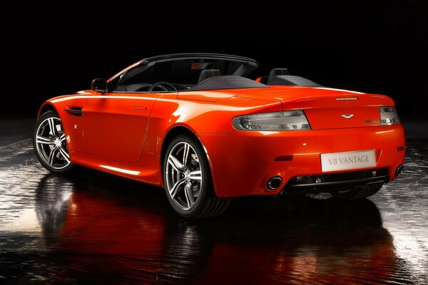 Orange aston martin vantage convertible