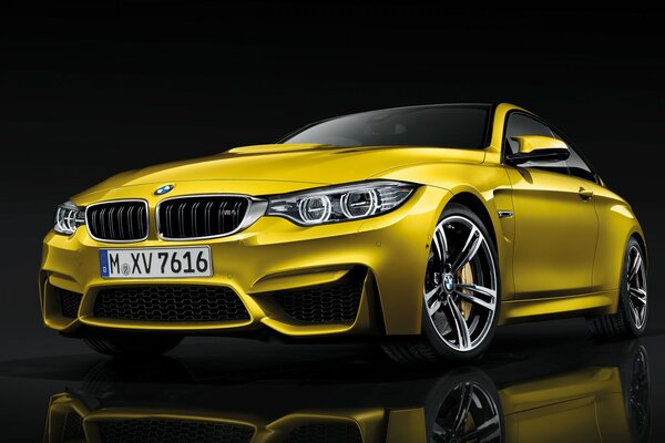 Yellow BMW model with cool wheels