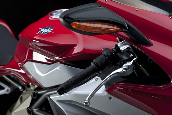 Part of the motorcycle is red-silver color