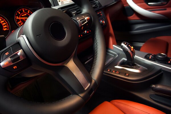 Beautiful interior of the car with orange seats