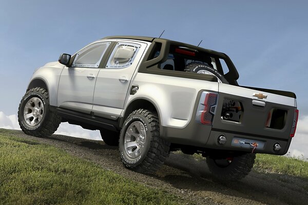 A gray Chevrolet SUV climbs the hill