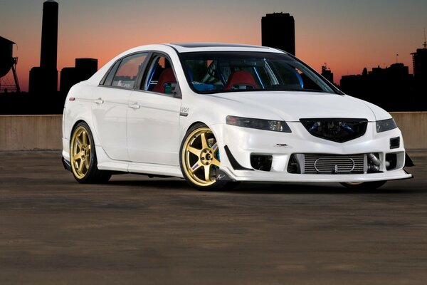 White Honda tuned with gold discs
