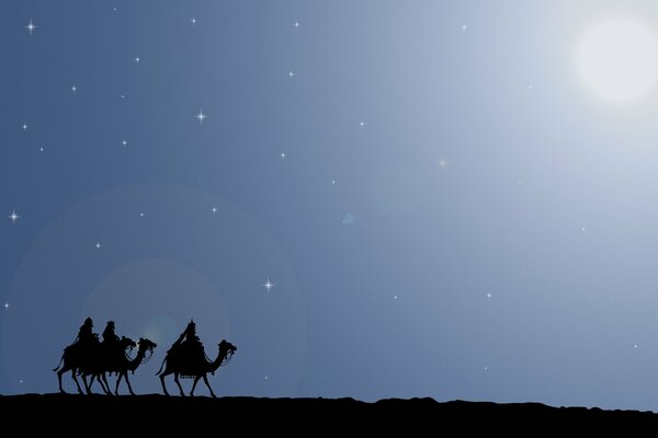 Sagome di viandanti sui cammelli nel deserto di notte
