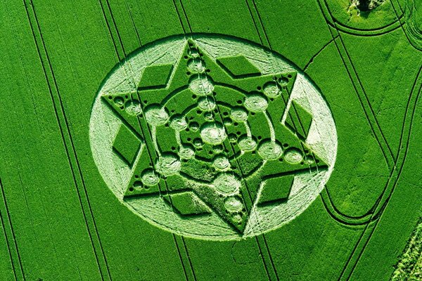 A circle on a green field in the form of a geometric pattern