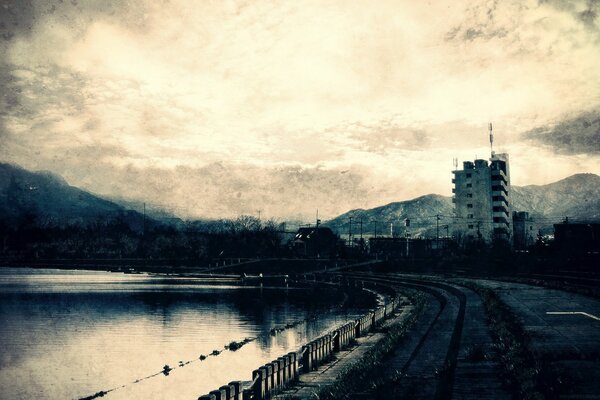 Grey city. Pond and embankment