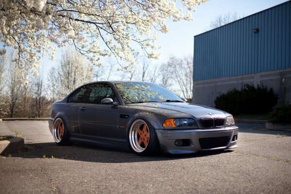 Grey car with orange wheels