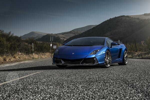 Lamborghini on asphalt against the background of mountains