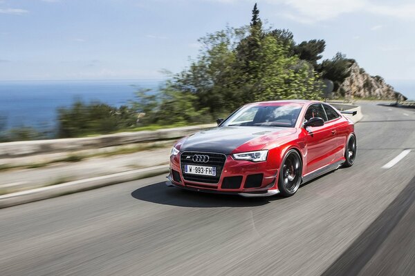 Tuning Audi is driving on the road at speed