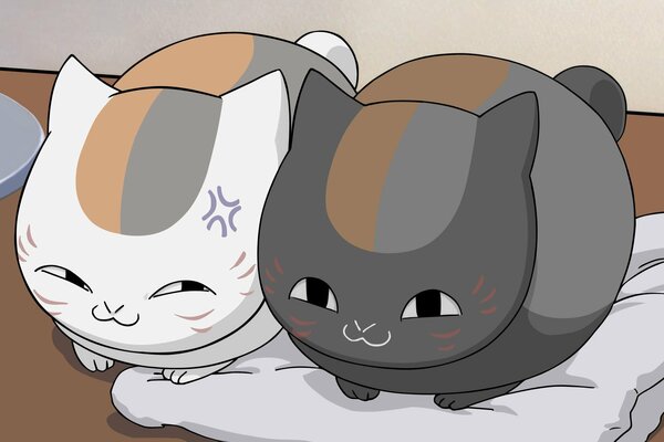 Two anime cats on a pillow gray and white