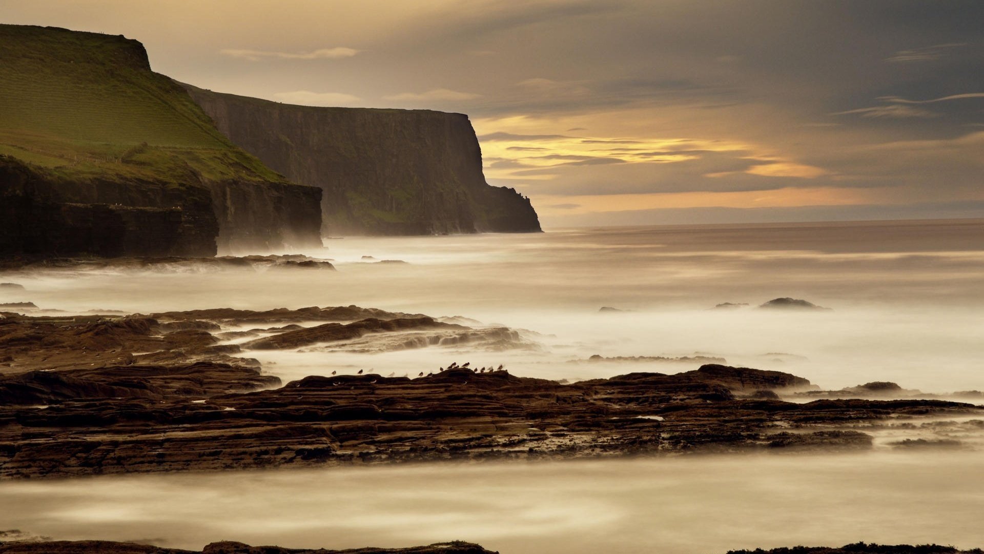 red blay the sky rocks water shore nature sea surf horizon landscape stones birds the evening sunset gloomy sky