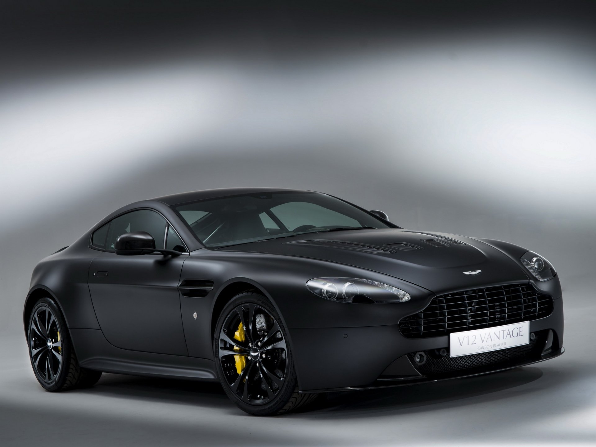 aston martin v12 vantage negro de carbono ii auto fondo frente ruedas frenos