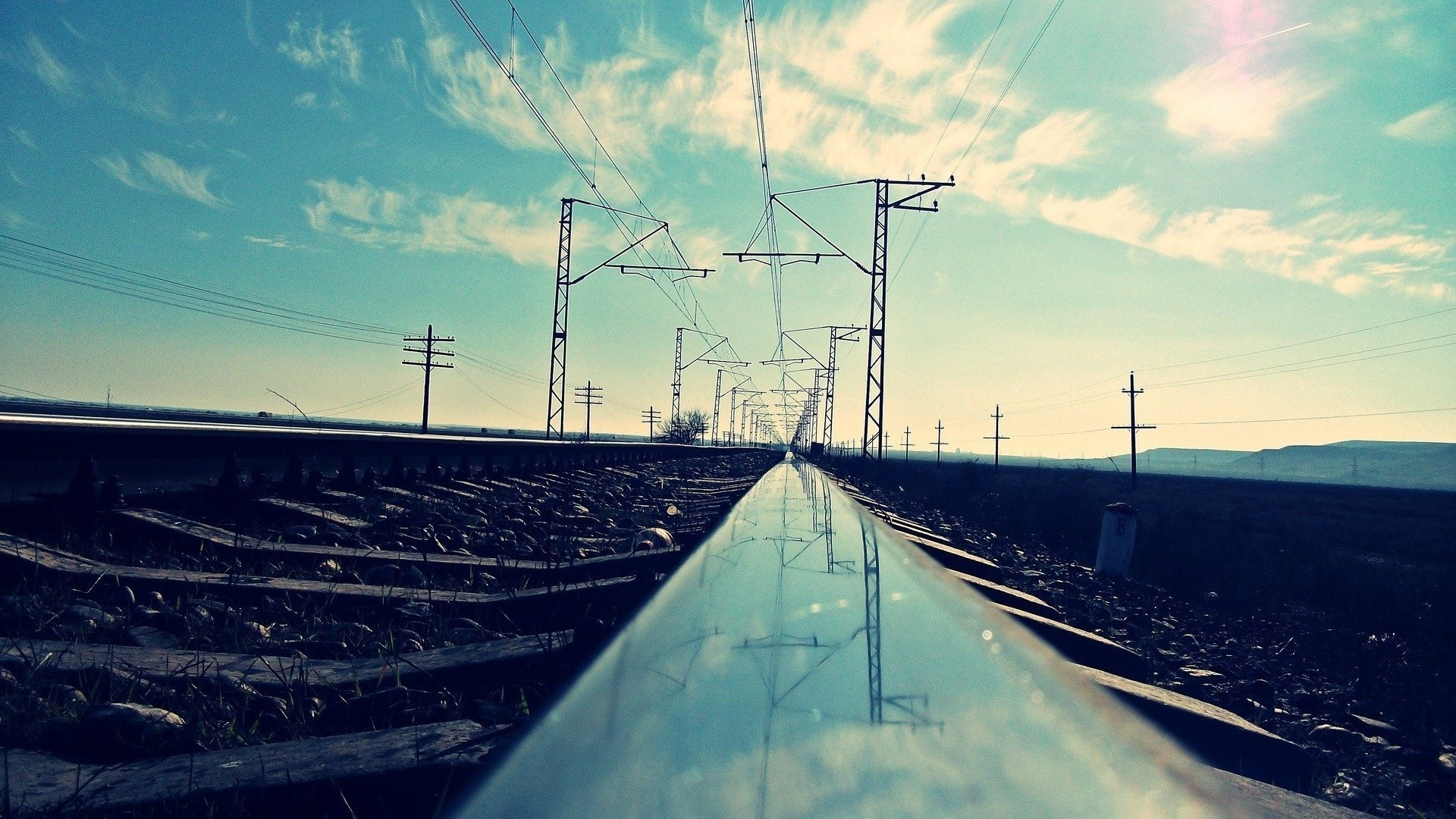 ner cov railroad posts the sky clouds reflection the way road rails sleepers railway transport