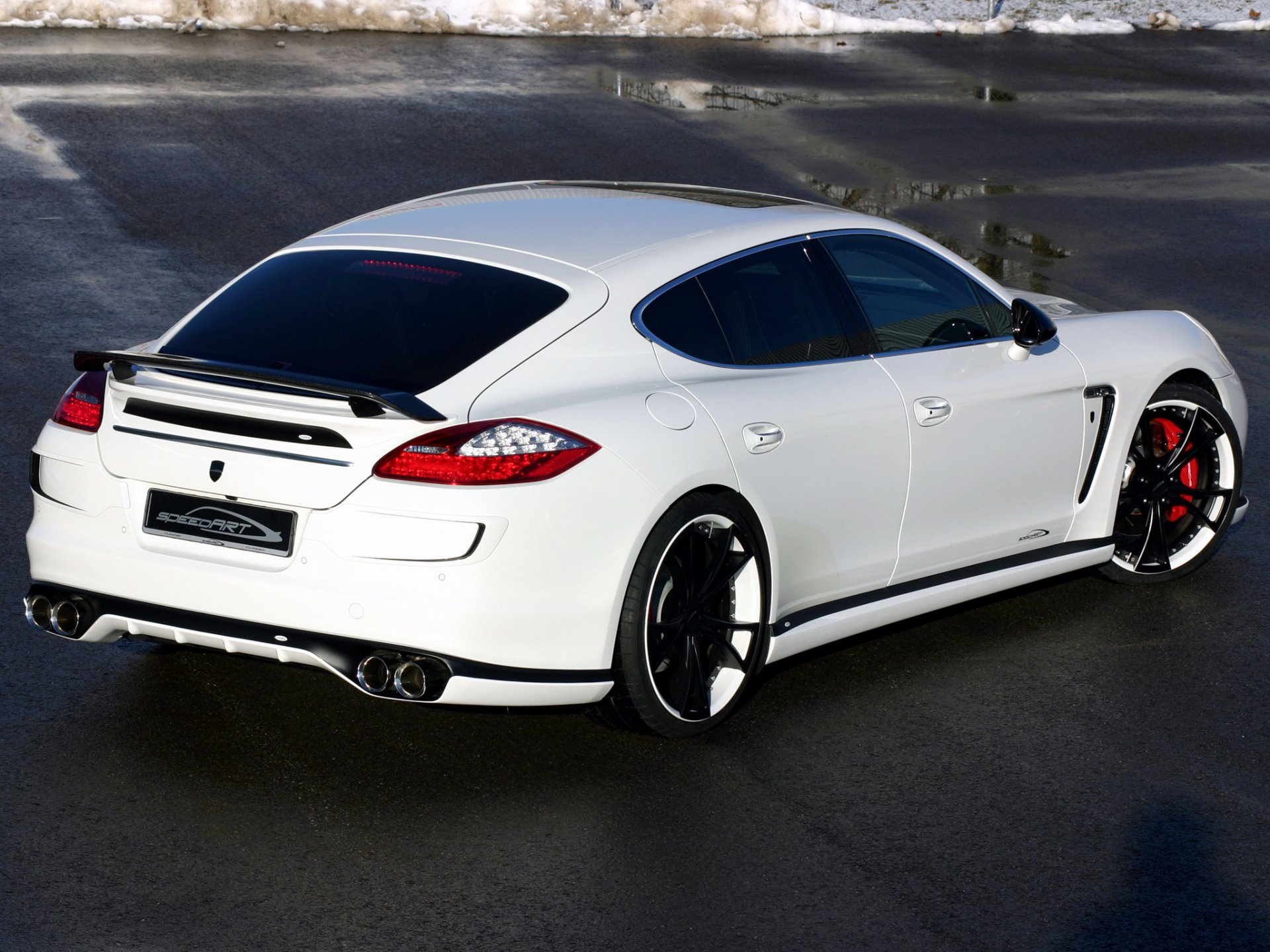 porsche panamera drives machine wheel white light road