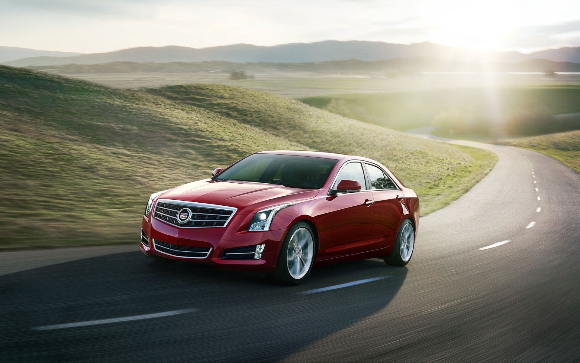 cadillac pbx cadilac sedán frente rojo carretera colinas sol fondo