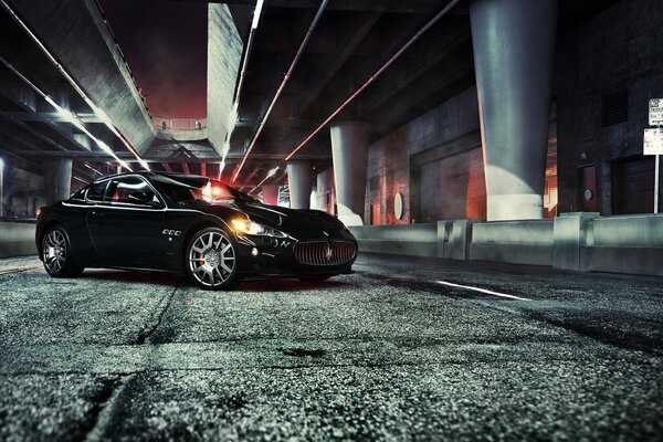 Black jaguar in the parking lot at night