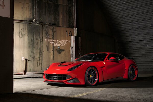 Beautiful red racing car on dark background