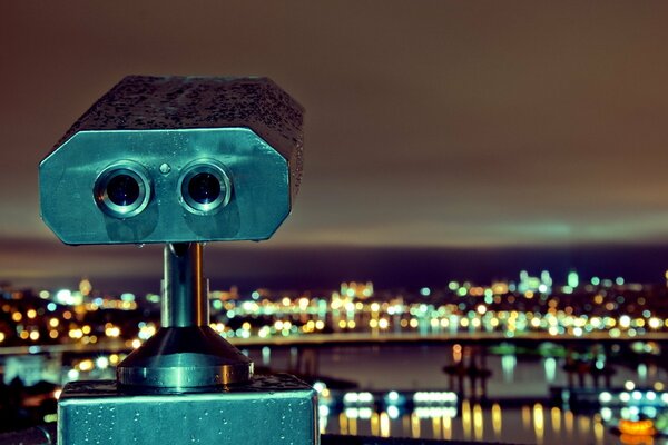 Luces de la ciudad, telescopio, cielo nocturno