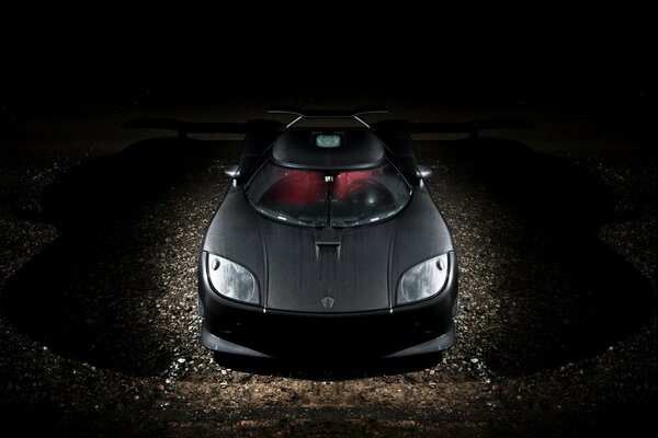 koenigsegg ccxr car with carbon body on dark background