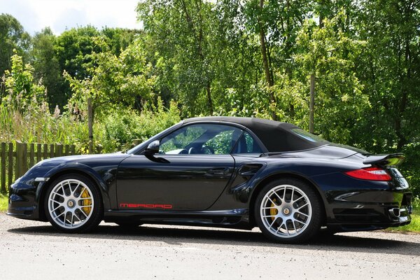 Summer landscape. Sports car PORSCHE-911