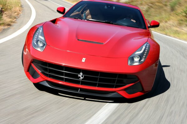 Red Ferrari at speed