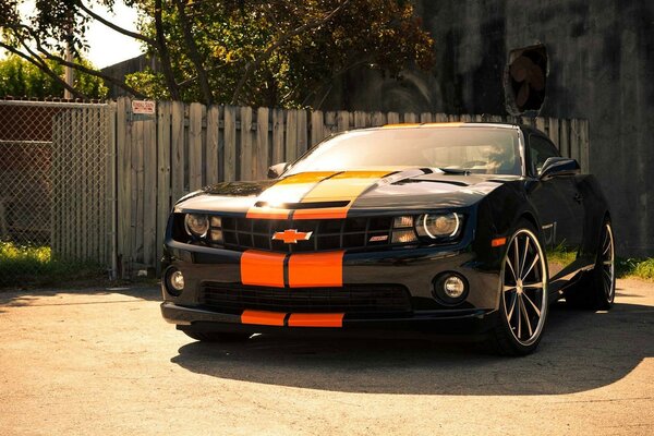 Black car with orange stripes