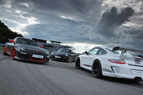 A rally of cool guys on cool cars