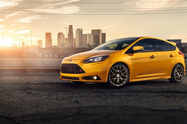 Yellow Ford focus on sunset background