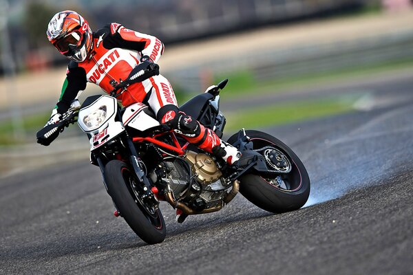 Motorsport, a man on a motorcycle racing