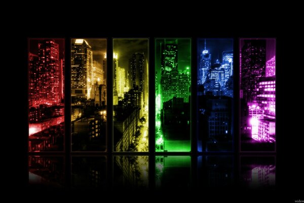Vista de la ciudad nocturna en ventanas multicolores