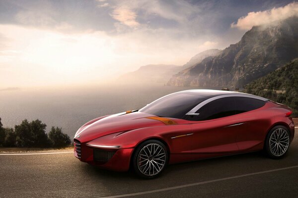Red alfa romeo car on the road against the background of mountains, sky and dawn