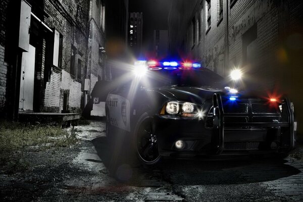 Police car with flashing light at night