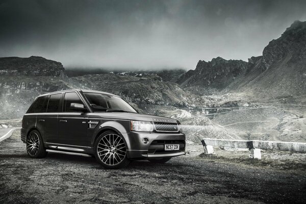 Tuned Range Rover in the mountains black and white photo