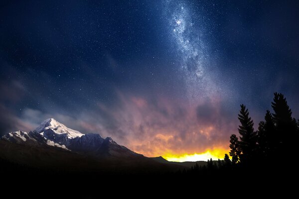 Ciel nocturne parmi les montagnes