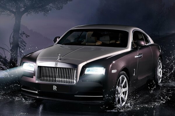 Rolls-Royce car on wet asphalt at night