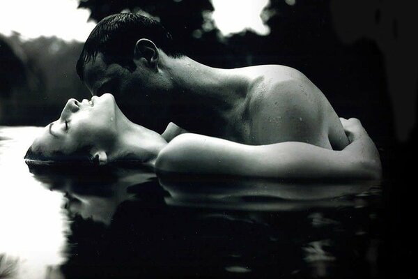 Couple in love nude in water black and white