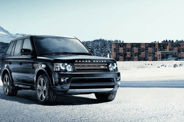 Black strict SUV on a snowy road