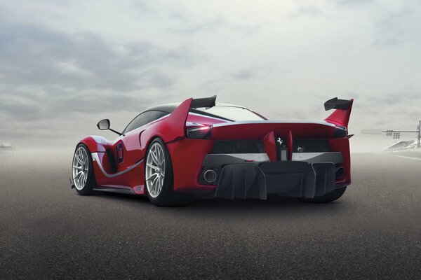 Feffari supercar bright red rear view against a gray sky